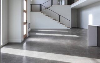 This image shows a living room with a polished concrete.